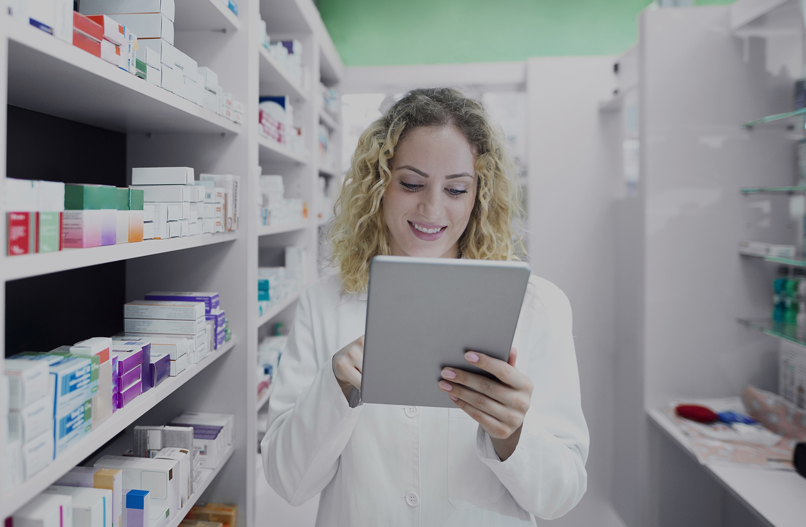 Female pharmacist working in drug store